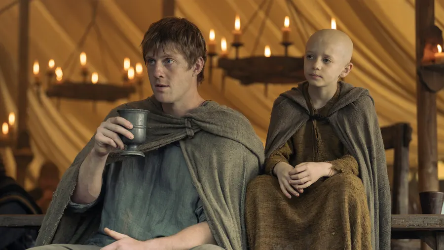 Dunk and Egg on the road through the Reach, golden hour on the hills of Westeros